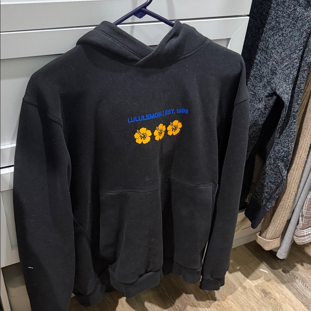 Lululemon Black hoodie w Blue and Yellow Floral Accents. Rare from Hawaii 2025.
